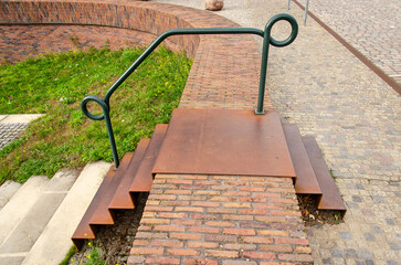 Zutphen, The Netherlands, September 29, 2024: corten steel steps across a flood protection wall around the harbour