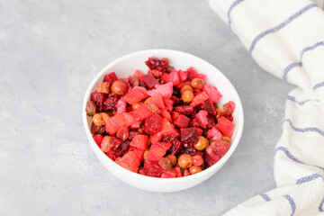 Vinaigrette beetroot alad on neutral background