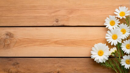 Obraz premium A bouquet of white daisies rests on a wooden surface, with a textured background.