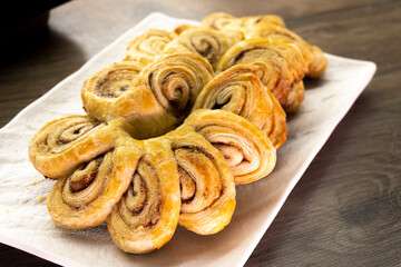 Puff pastry flowers with cinnamon sugar.Puff pastry. Dessert. Cinnamon. Sugar. Food concept