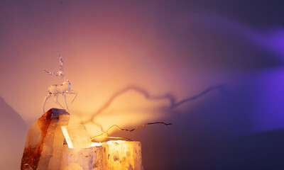 glass figurine of a deer on a light background