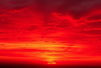 Crimson Glow A vibrant crimson hued sunset with deep red and ora