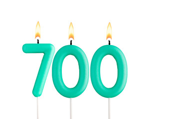 Green candles forming the number 700 - Number of views, views or followers.