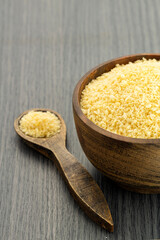 Yellow japanese panko crumbs in the spoon and bowl.