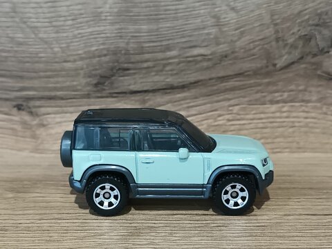 Close-up of a Matchbox Land Rover Defender toy model car on a white background