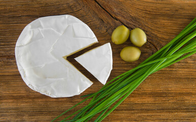 Delicious Camembert cheese, olives, chives