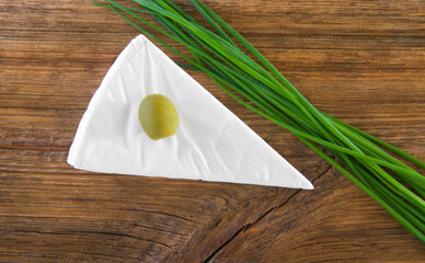 Delicious Camembert cheese, olives, chives