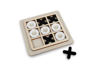 A wooden game set of noughts and crosses on a black background, tic-tac-toe