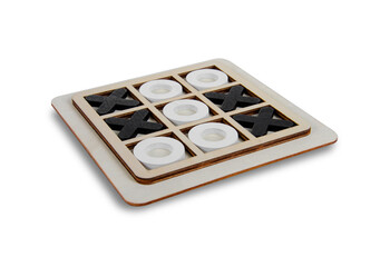 A wooden game set of noughts and crosses on a black background, tic-tac-toe