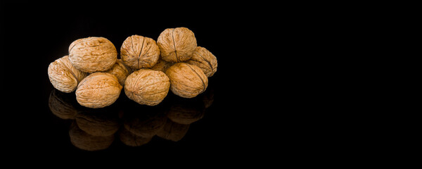 Walnuts Isolated on Black Background with text space