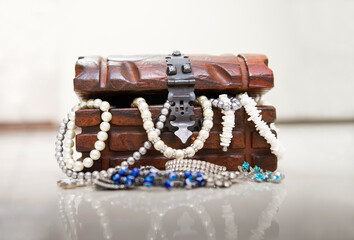 chest with jewelry and pearl bracelet