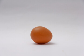 a chicken egg on a white background