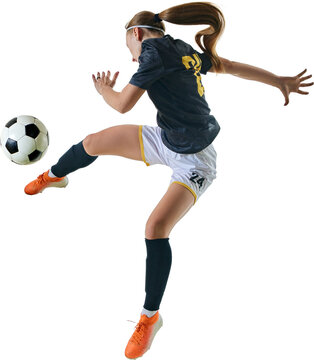 Determined female soccer player performing impressive acrobatic kick, aiming at ball during competitive match against transparent background. Concept of sport, competition, tournament, games, event.