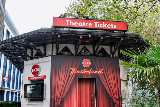 Theatre ticket booth TKTS in London's Theatreland, adorned with red signage.