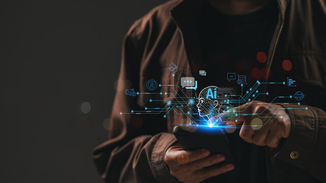 A man holding a cell phone looks at the screen, exploring an AI-powered business concept that leverages advanced technology for innovative solutions.