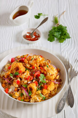 cauliflower chickpea quinoa salad in a white bowl