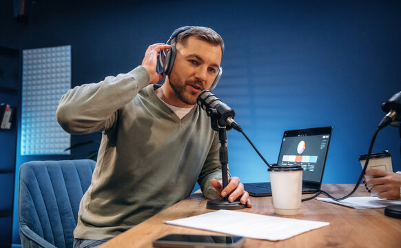 Morning radio. Man with microphone in the studio, conception of podcast