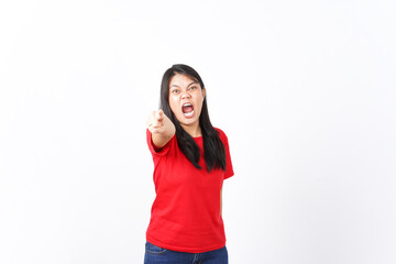 Fototapeta premium beautiful Asian woman screams with excitement, pointing forward in an expressive pose against a white background