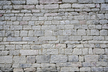 Old stone wall on building, close up. Wall texture. Pattern.