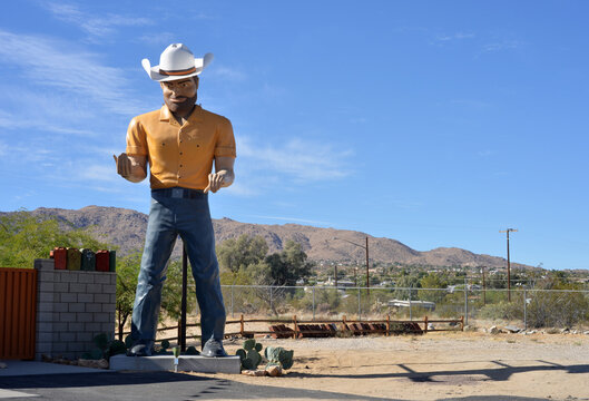 Joshua Tree, USA, huge cowboy figure outside a station