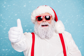 Close up photo of funny funky fat overweight santa claus have modern hipster eyeglasses show thumb...