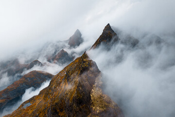 The Mysterious Mountain Peaks Are Enveloped in a Thick, Atmospheric Fog Full of Enigma
