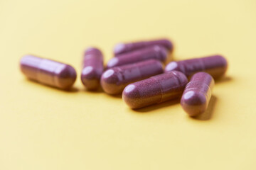 Lutein capsules. Dietary supplement on bright background. Soft focus. Close up. Copy space	