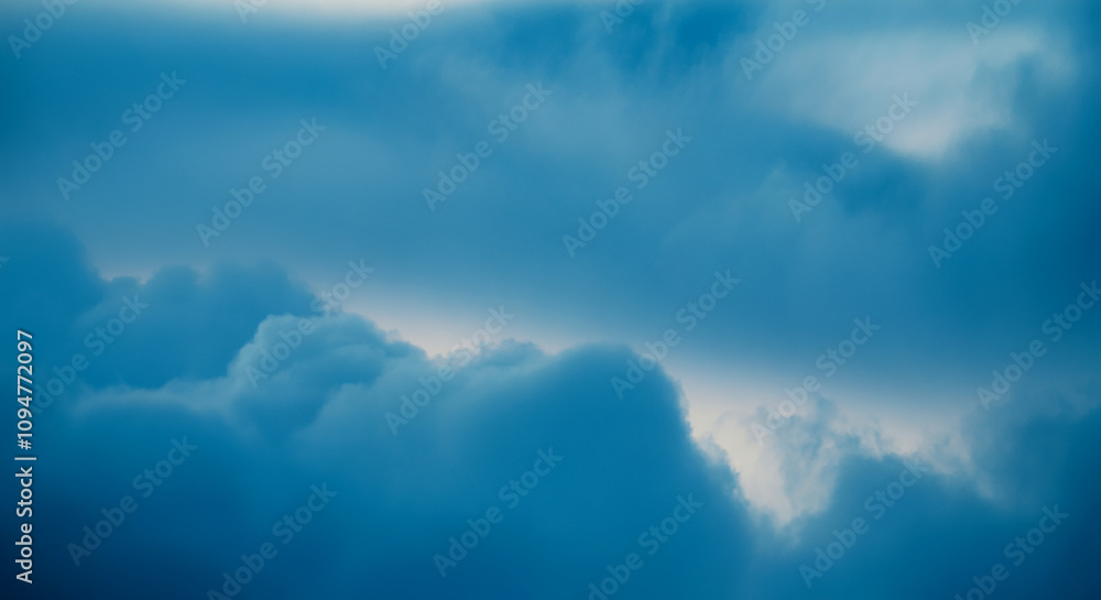 Poster smooth blue cloud pattern in the form of a abstract against a background of a cloudy sky . ideal for