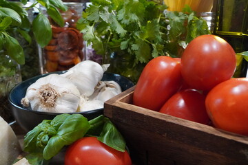 A classic Italian pasta dish, Capellini Pomodoro with fresh tomatoes, basil and garlic. Making an Italian meal for dinner using fresh ingredients from the garden.