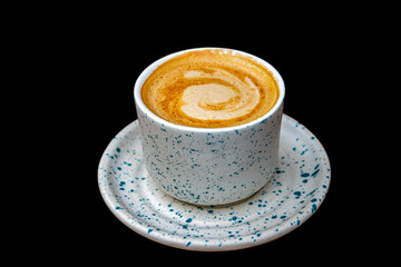 Closeup of a ceramic  cup of coffee with saucer 