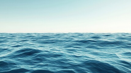 Calm ocean waves under clear sky during daylight creating a serene coastal atmosphere
