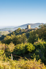 View of Pietrarubbia castle in Montefeltro, part of the Italian Marches region near Pesaro and Urbino, in the Carpegna district. San Marino Republic appears in the far background