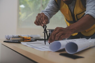 Image of engineer meeting for architectural project. working with partner and engineering tools on workplace vintage tone.