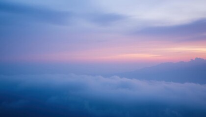 Fototapeta premium view of a mountain range with a pink sky