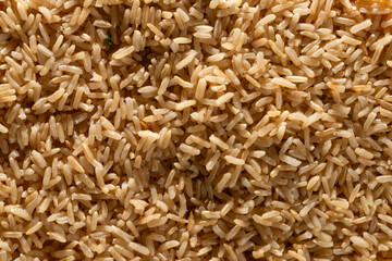 Brown rice background on a plate. rice texture