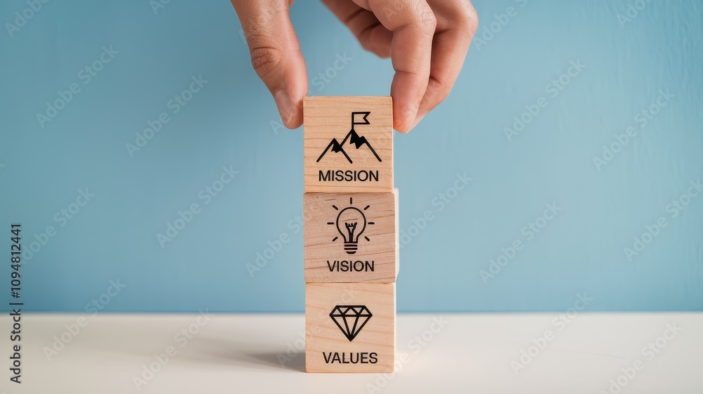 Poster wooden blocks stacked with the words mission vision and values representing the core elements that p