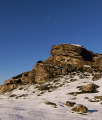 snow covered mountains with blue skies 