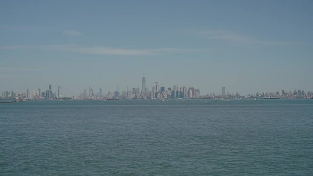 NYC_Boats in Focus, Manhattan, Jersey City, and Brooklyn Skyline Extreme Wide Shot - 1080p 48fps