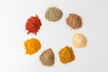 Set of spices and herbs. Indian cuisine. Turmeric, coriander, oregano, curry, paprika, dried garlic.