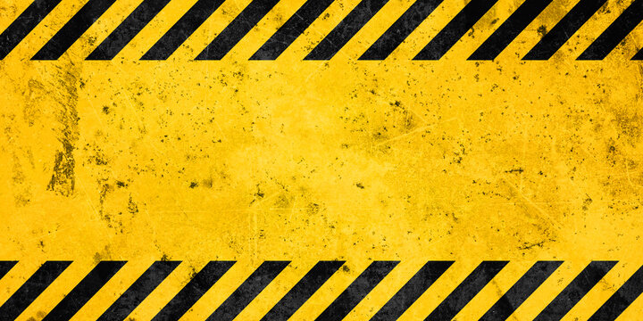 Grunge yellow and black diagonal stripes. Industrial warning background, warn caution, construction, safety