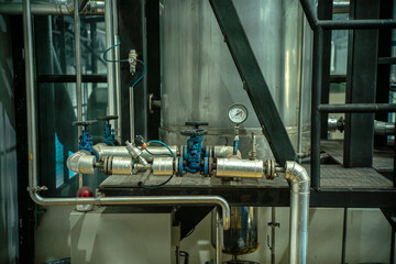 Factory interior with industrial machinery, tools, and equipment for manufacturing processes