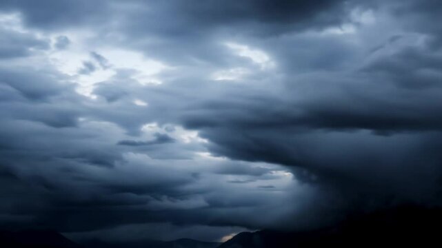 Dark storm clouds rolling across the sky in a dramatic weather scene. Concept of power and unpredictability in nature.