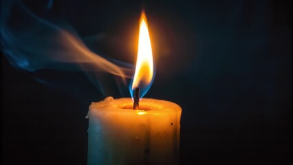 A Single Candle Burning with Smoke in the Dark
