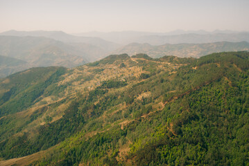 Fototapeta premium Aerial view of green and colorful rice field terraces, Nepal