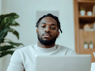 Confident Businessman Sitting in Modern Office for Professional Portrait
