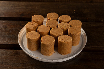Sweet Brazilian Peanut Called Paçoca on a wooden desk