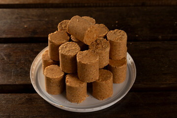Sweet Brazilian Peanut Called Paçoca on a wooden desk