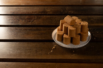 Sweet Brazilian Peanut Called Paçoca on a wooden desk