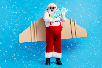 Full length photo of white grey hair bearded santa claus play water gun have wings x-mas christmas...