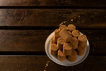 Fototapeta premium Sweet Brazilian Peanut Called Paçoca on a wooden desk